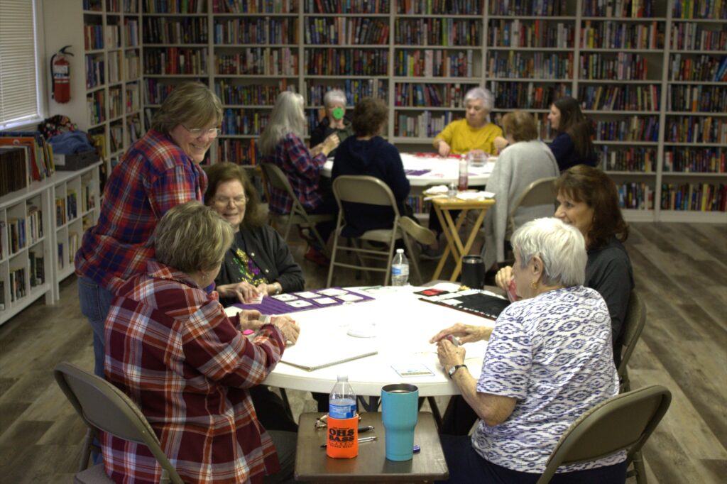 A group of people sitting around a table.