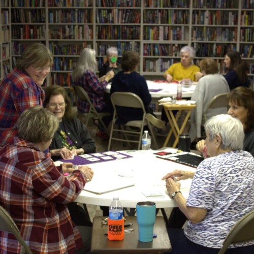A group of people sitting around a table.